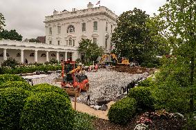 Workers Reconstruct the Rose Garden to Pavement at the White House