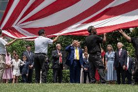 U.S. President Donald Trump Watches as the American Flag is Raised ont he South Lawn