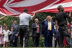 U.S. President Donald Trump Watches as the American Flag is Raised ont he South Lawn