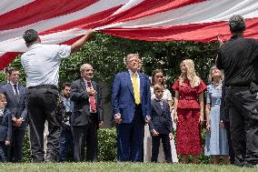 U.S. President Donald Trump Watches as the American Flag is Raised ont he South Lawn