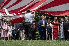 U.S. President Donald Trump Watches as the American Flag is Raised ont he South Lawn