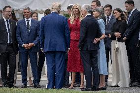 U.S. President Donald Trump Watches as the American Flag is Raised ont he South Lawn