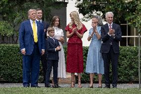 U.S. President Donald Trump Watches as the American Flag is Raised ont he South Lawn