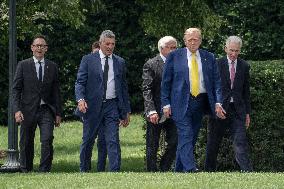 U.S. President Donald Trump Watches as the American Flag is Raised ont he South Lawn