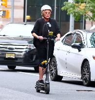 Deborra-Lee Furness Riding Her Scooter - NYC