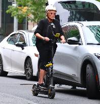 Deborra-Lee Furness Riding Her Scooter - NYC