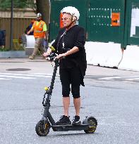 Deborra-Lee Furness Riding Her Scooter - NYC