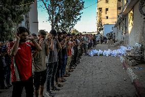 Palestinians Mourn Airstrike Victims at Al-Shifa Hospital - Gaza