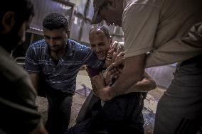 Palestinians Mourn Airstrike Victims at Al-Shifa Hospital - Gaza