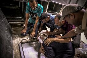 Palestinians Mourn Airstrike Victims at Al-Shifa Hospital - Gaza