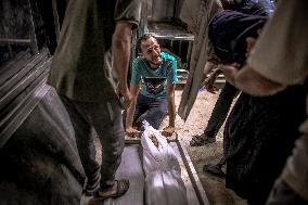 Palestinians Mourn Airstrike Victims at Al-Shifa Hospital - Gaza