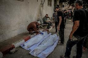 Palestinians Mourn Airstrike Victims at Al-Shifa Hospital - Gaza