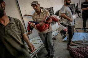 Palestinians Mourn Airstrike Victims at Al-Shifa Hospital - Gaza
