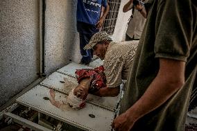 Palestinians Mourn Airstrike Victims at Al-Shifa Hospital - Gaza