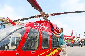 Helicopters Conduct Aerial Patrols on Ultra-high Voltage Transmission Lines