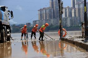 Clearing Silt After Flood in Rong'an