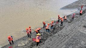 Clearing Silt After Flood in Rong'an