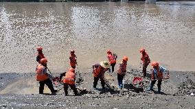 Clearing Silt After Flood in Rong'an