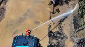 Clearing Silt After Flood in Rong'an