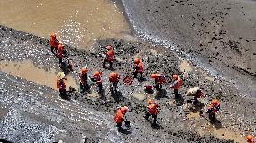 Clearing Silt After Flood in Rong'an