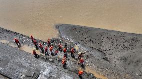 Clearing Silt After Flood in Rong'an