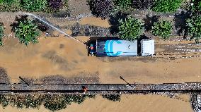 Clearing Silt After Flood in Rong'an