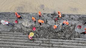 Clearing Silt After Flood in Rong'an