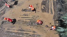 Clearing Silt After Flood in Rong'an