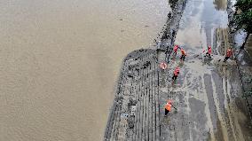 Clearing Silt After Flood in Rong'an