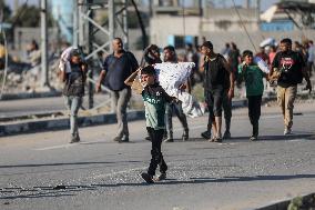 Palestinians Carry Collected Tree Branches and Scrap Wood - Gaza