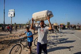 Palestinians Carry Collected Tree Branches and Scrap Wood - Gaza