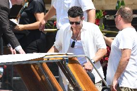 Orlando Blum leaves his hotel in Venice