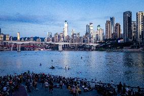 Citizens Enjoy Coolness in Jialing River in Chongqing