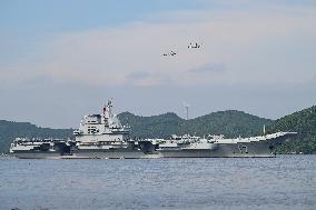Aircraft Carrier Shandong Sailing In Hong Kong Waters