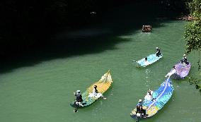 Tourists Take Feather-Shaped Boats - China