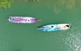 Tourists Take Feather-Shaped Boats - China