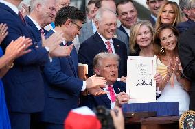 Trump Signs Tax Bill And Watches July 4th Parade