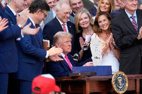 Trump Signs Tax Bill And Watches July 4th Parade