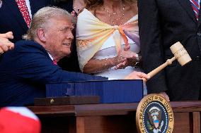 Trump Signs Tax Bill And Watches July 4th Parade