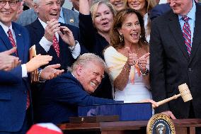Trump Signs Tax Bill And Watches July 4th Parade