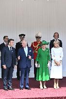 Emmanuel And Brigitte Macron Attend Welcoming Ceremony in Windsor