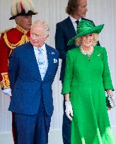 Emmanuel And Brigitte Macron Attend Welcoming Ceremony in Windsor