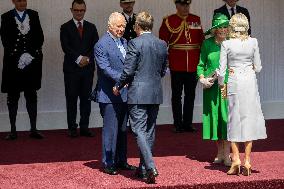 Emmanuel And Brigitte Macron Attend Welcoming Ceremony in Windsor