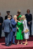 Emmanuel And Brigitte Macron Attend Welcoming Ceremony in Windsor