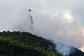 Air Rescue Operations During a Mountain Fire - Italy