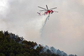 Air Rescue Operations During a Mountain Fire - Italy