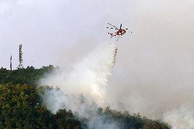 Air Rescue Operations During a Mountain Fire - Italy