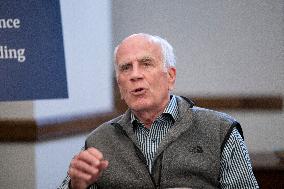 United States Senator Peter Welch (Democrat of Vermont) gives pen and pad on reformation of FEMA