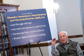 United States Senator Peter Welch (Democrat of Vermont) gives pen and pad on reformation of FEMA