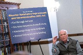 United States Senator Peter Welch (Democrat of Vermont) gives pen and pad on reformation of FEMA